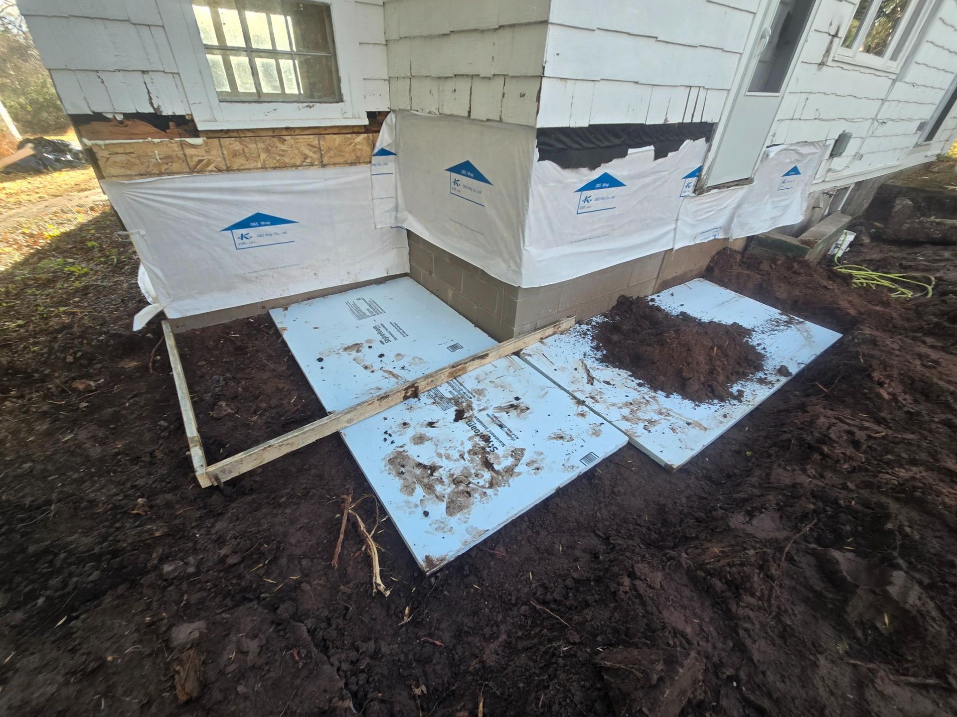 A house is being built on top of a pile of dirt.
