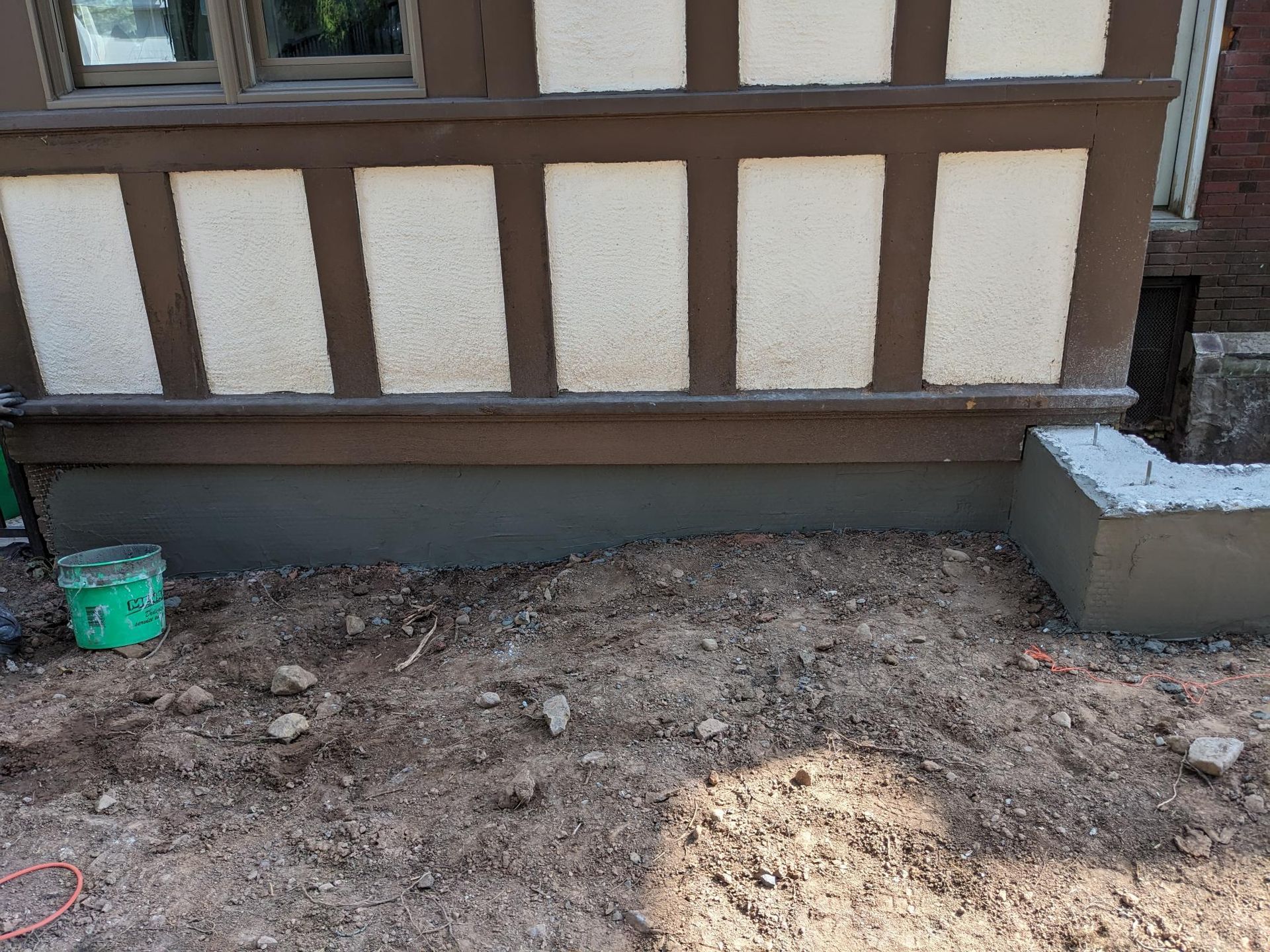 A concrete block is sitting in front of a building.