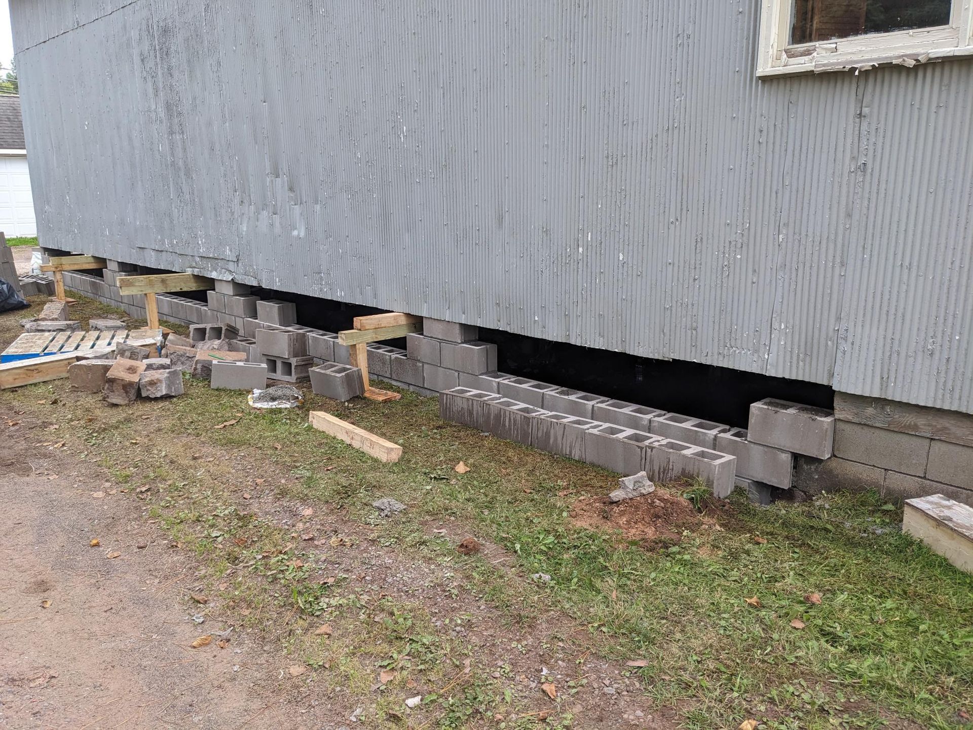 A house is being built on a concrete foundation.