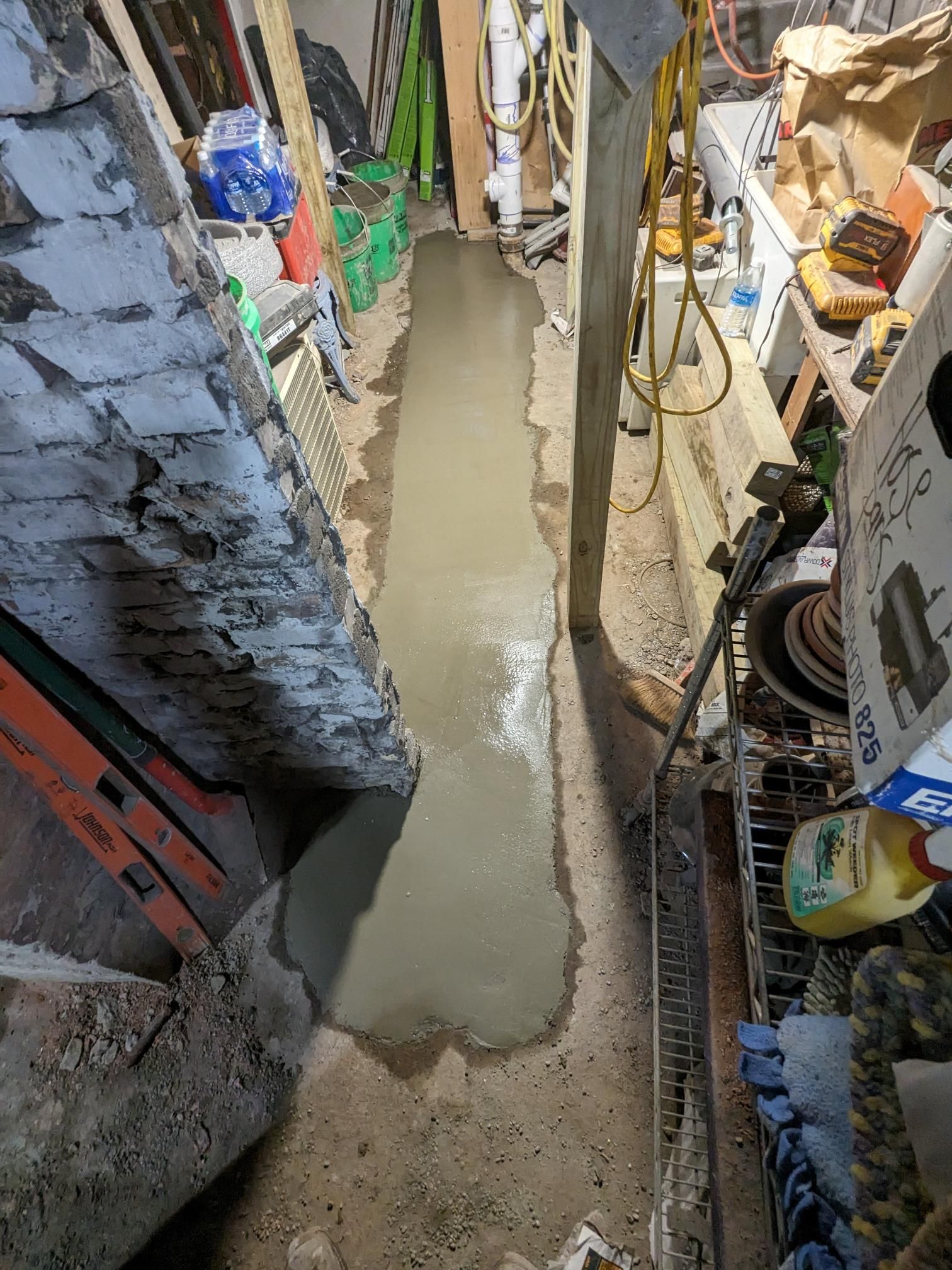 There is a hole in the ground in the middle of a room.