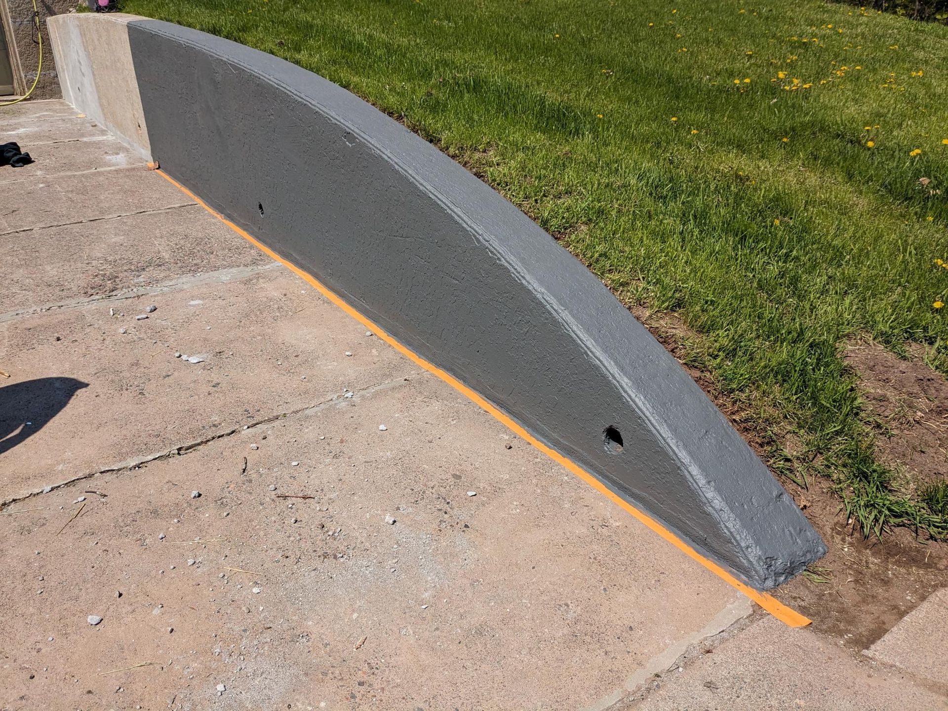 A concrete ramp with a hole in the middle of it
