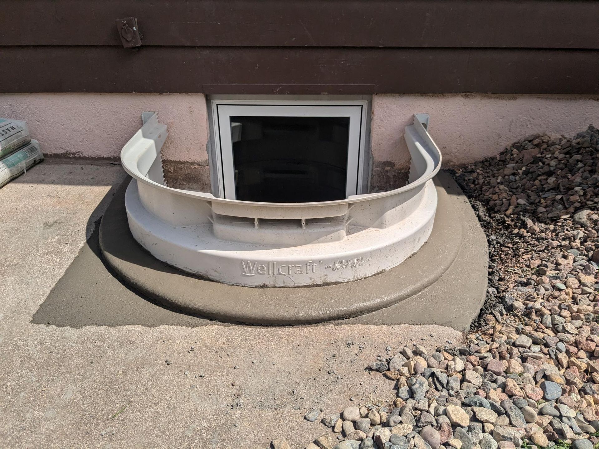 A window well in the basement of a house.