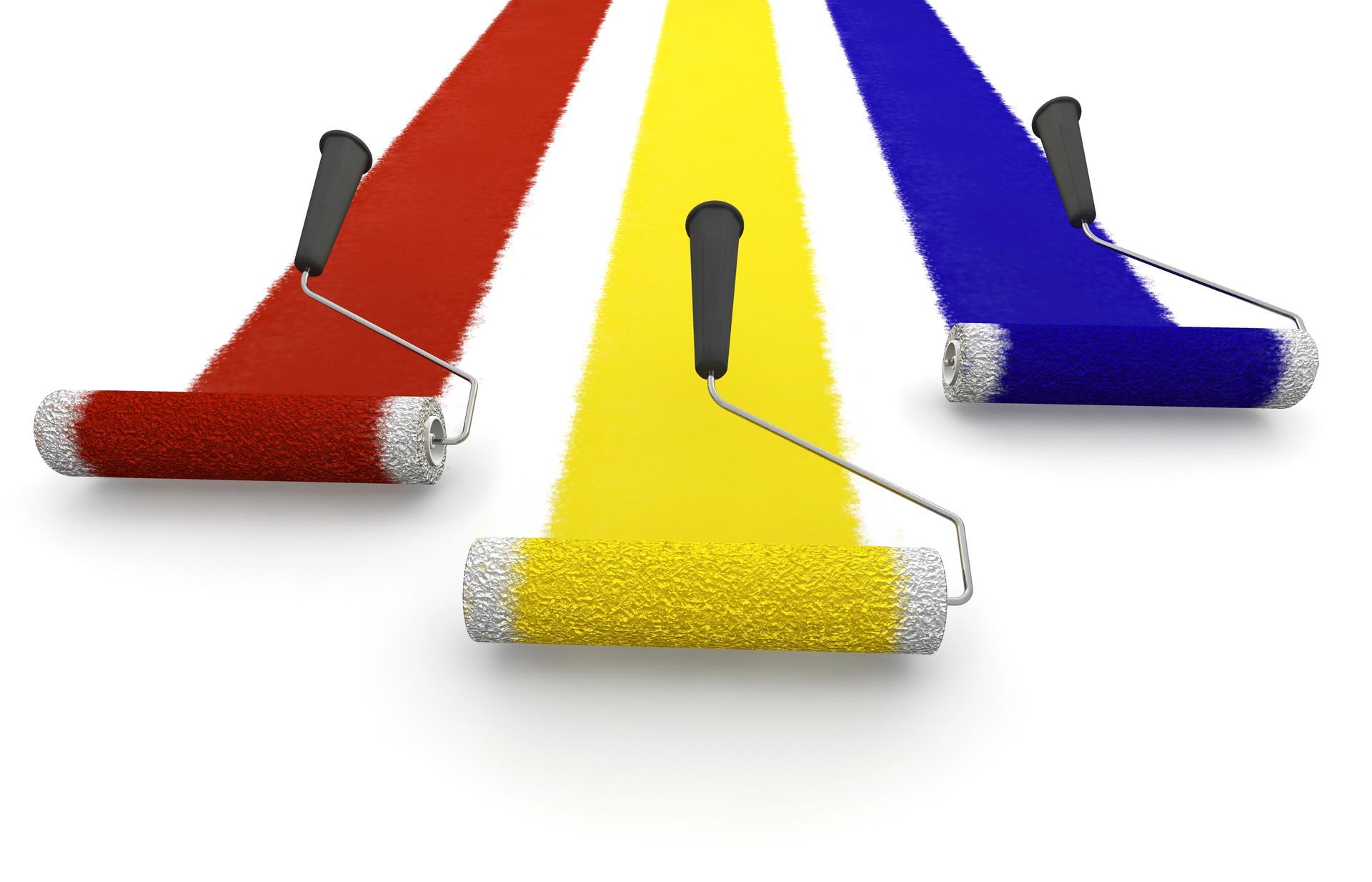 Paint rollers applying red, yellow, and blue paint strokes on a white surface.
