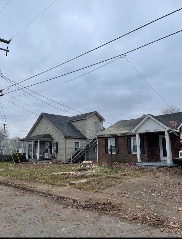 A couple of houses sitting next to each other on a street