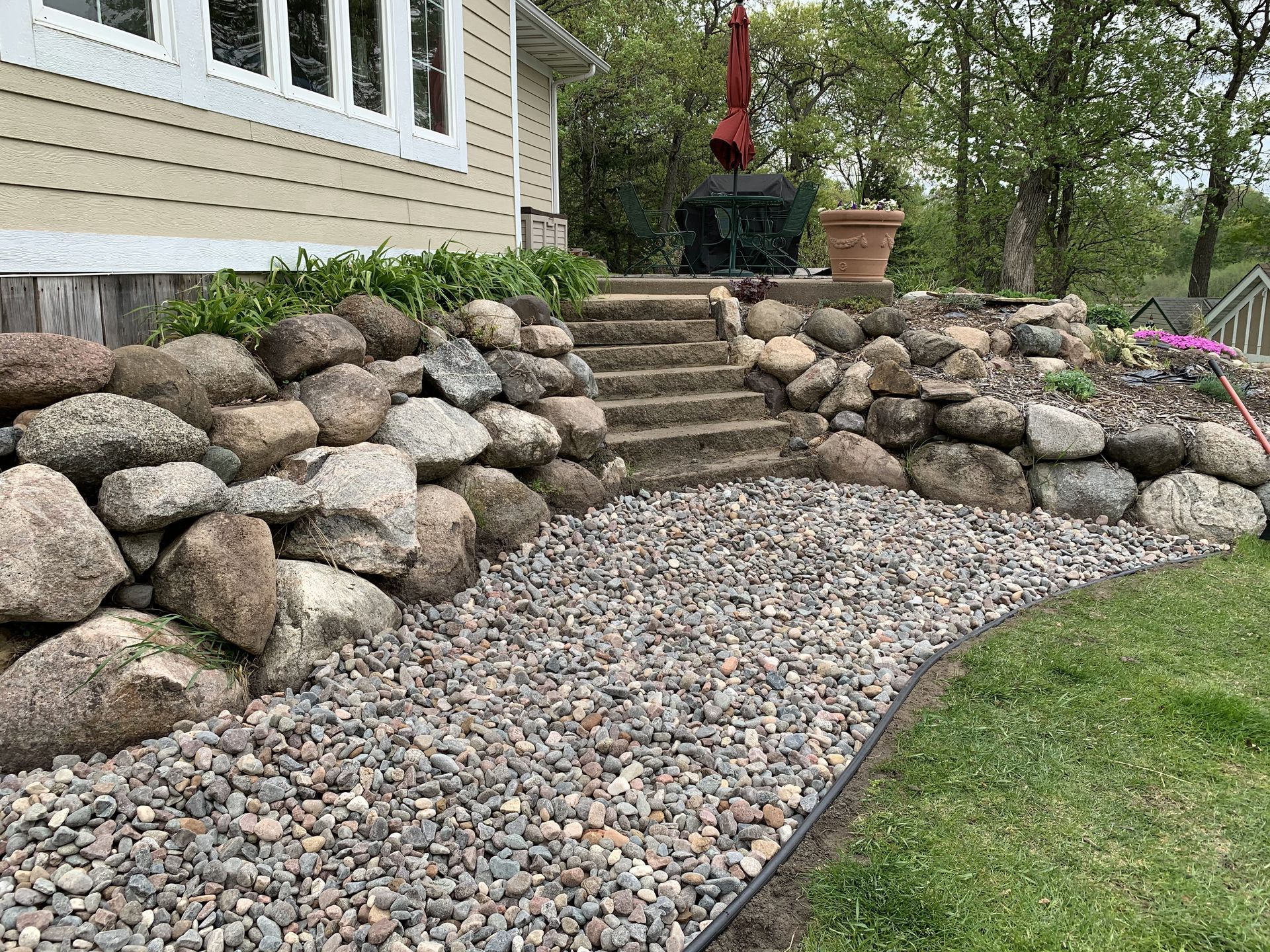 boulder retaining wall river rock walkway edging stairs deck