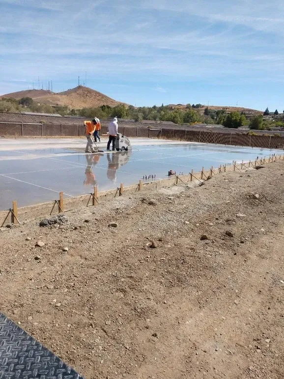 A group of people are working on a large body of water.