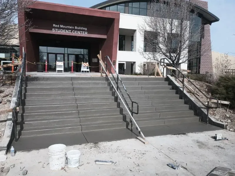 Stairs leading up to a building that says building center