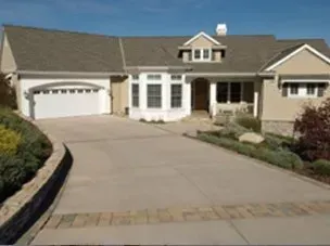 A large house with a driveway leading to it