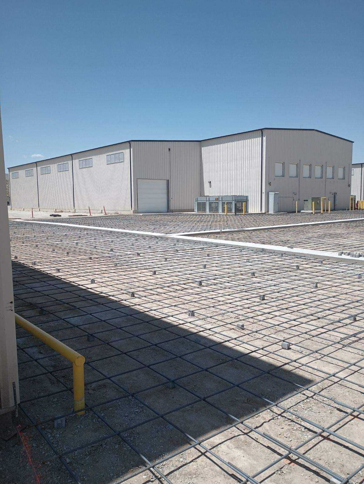 A large building with a lot of concrete in front of it