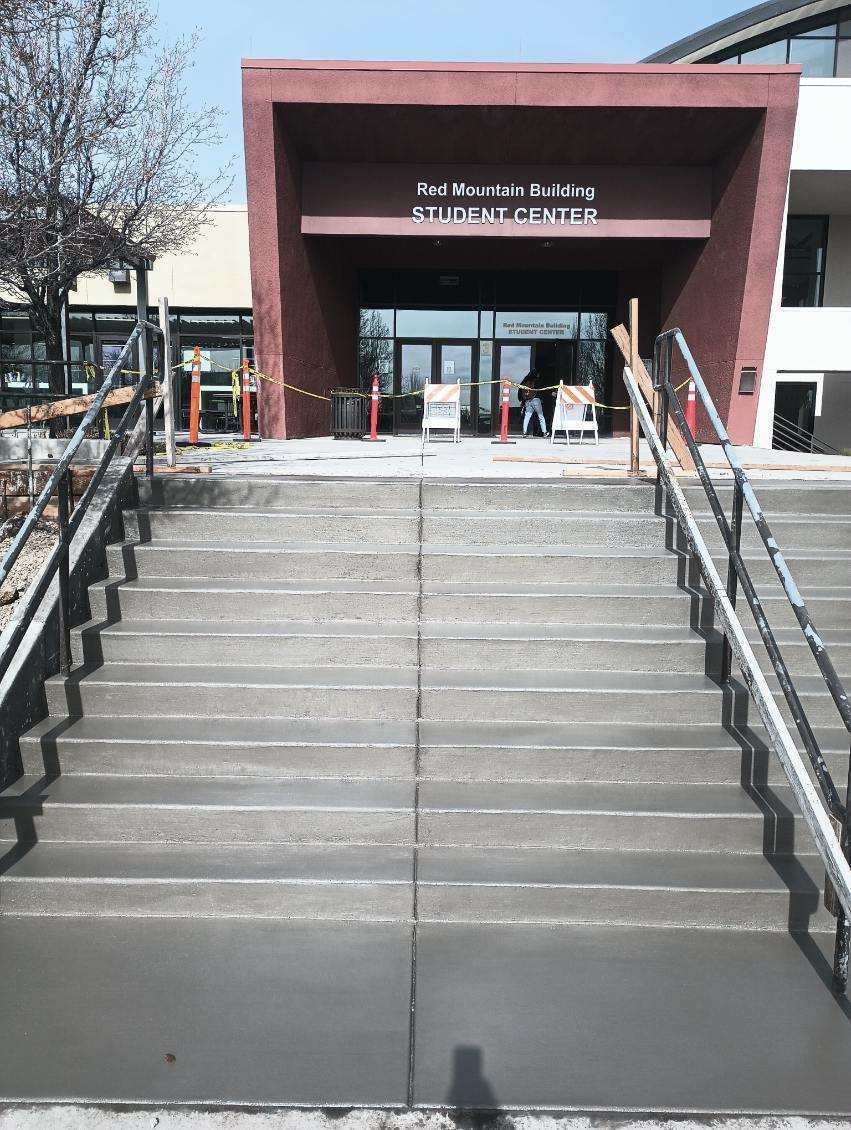 A set of stairs leading up to the entrance of a building.