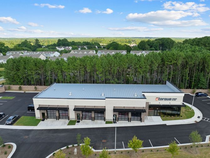 Exterior of TForce Automotive building with black awning and large windows. | Torque European Car Care