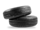 Two black car tires stacked on top of each other, displaying their tread pattern. | Torque European Car Care