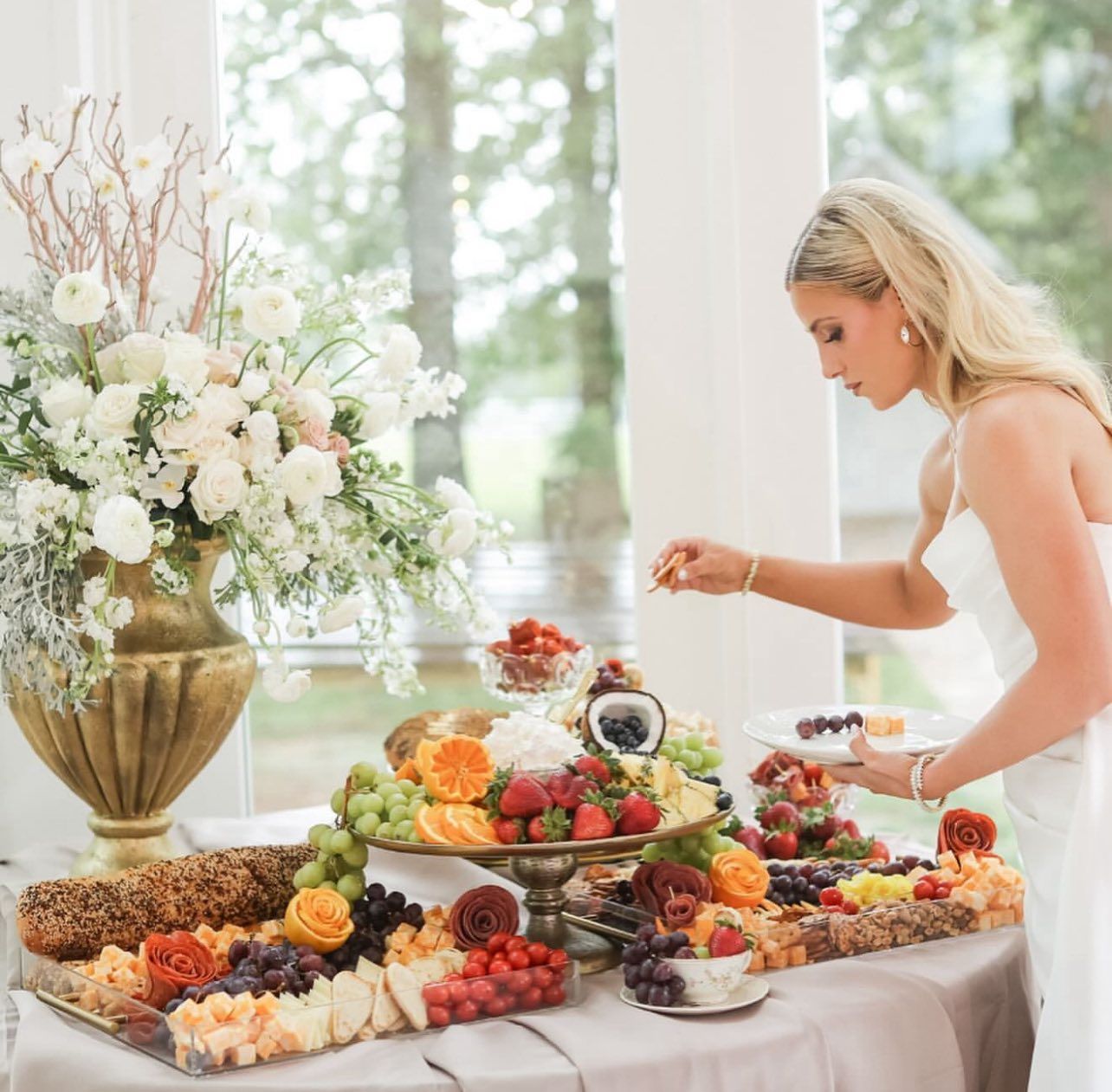 bride eating from grazing table