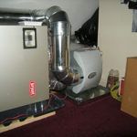 A room with a heater and air conditioner in it.