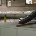 A large pipe is sitting on top of a table in a room.