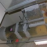 A ceiling with a lot of books hanging from it.