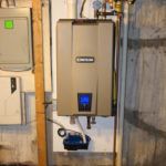 A water heater is hanging on a wall in a basement.