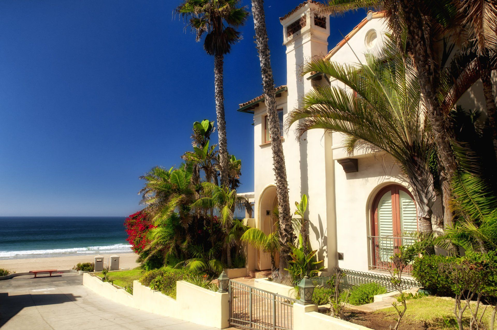 The generic architecture of West Coast Beach homes on Manhattan beach California on a sunny blue sky day.