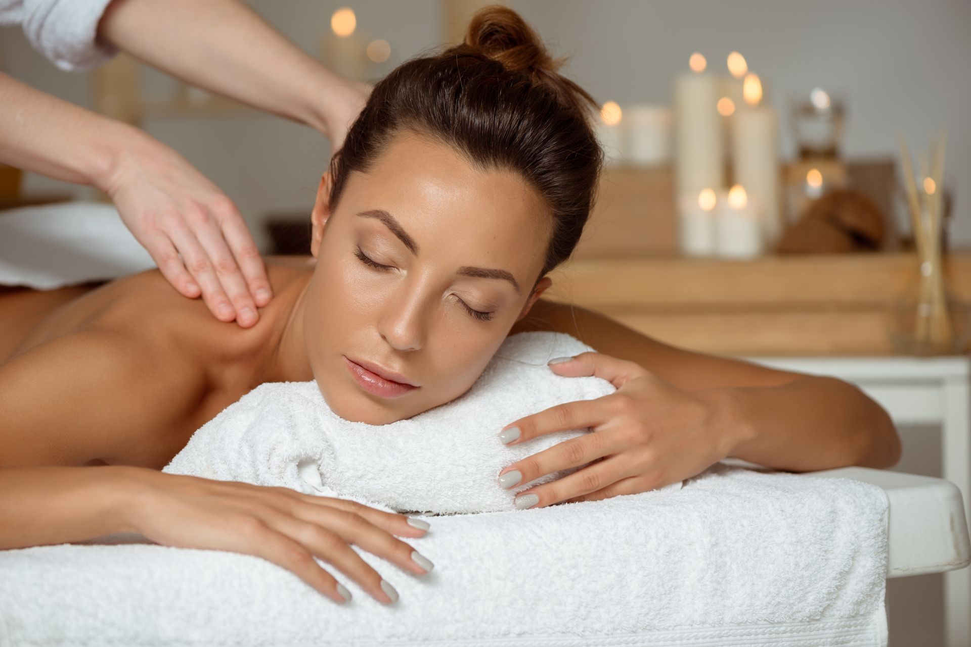 A woman is getting a massage at a spa.