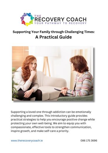 A woman is sitting on a couch talking to a recovery coach.