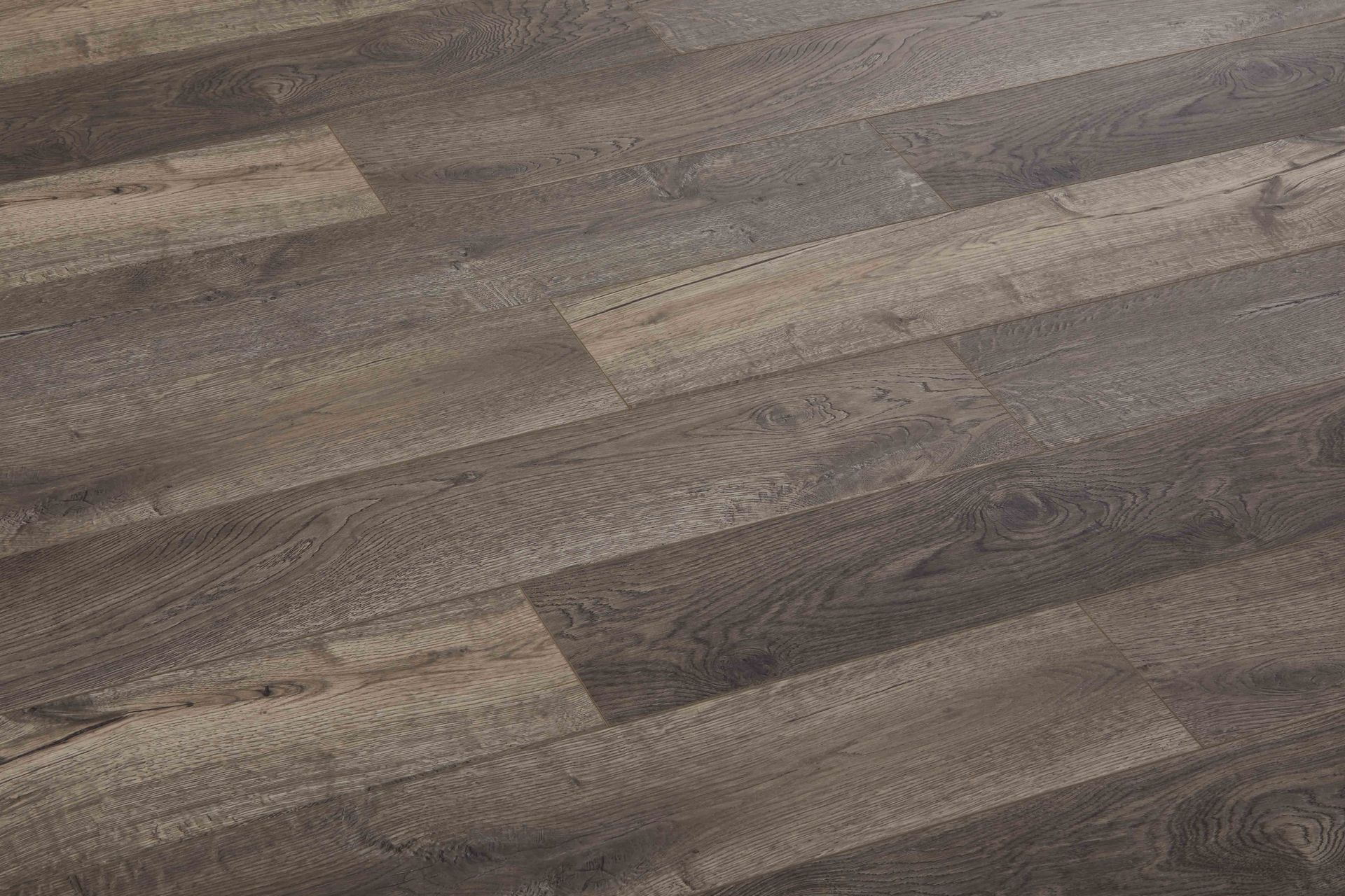 Close-up of hardwood flooring in varying shades of brown and gray.