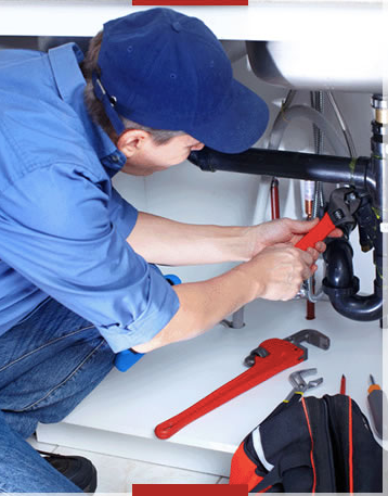 plumber fixing sink using wrench