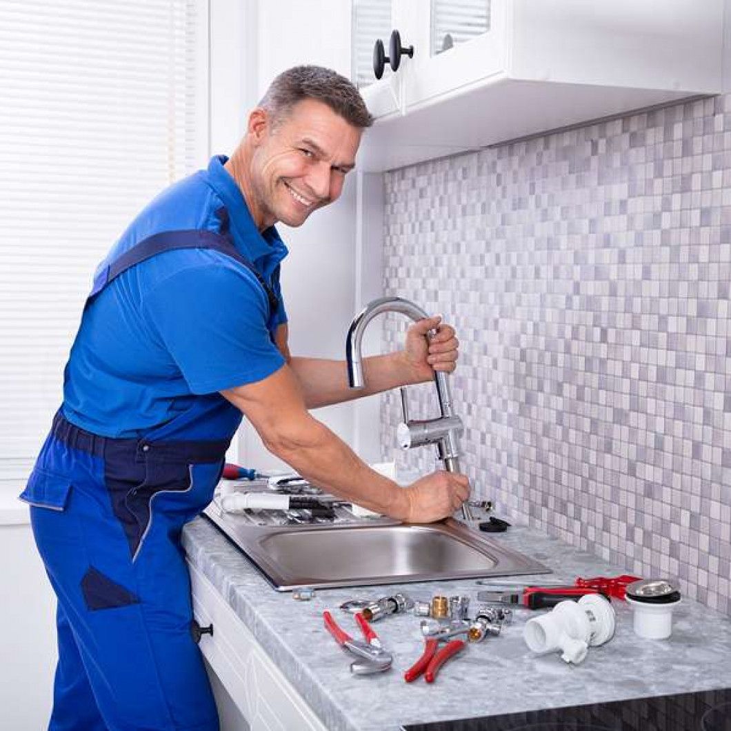 plumber repairing sink
