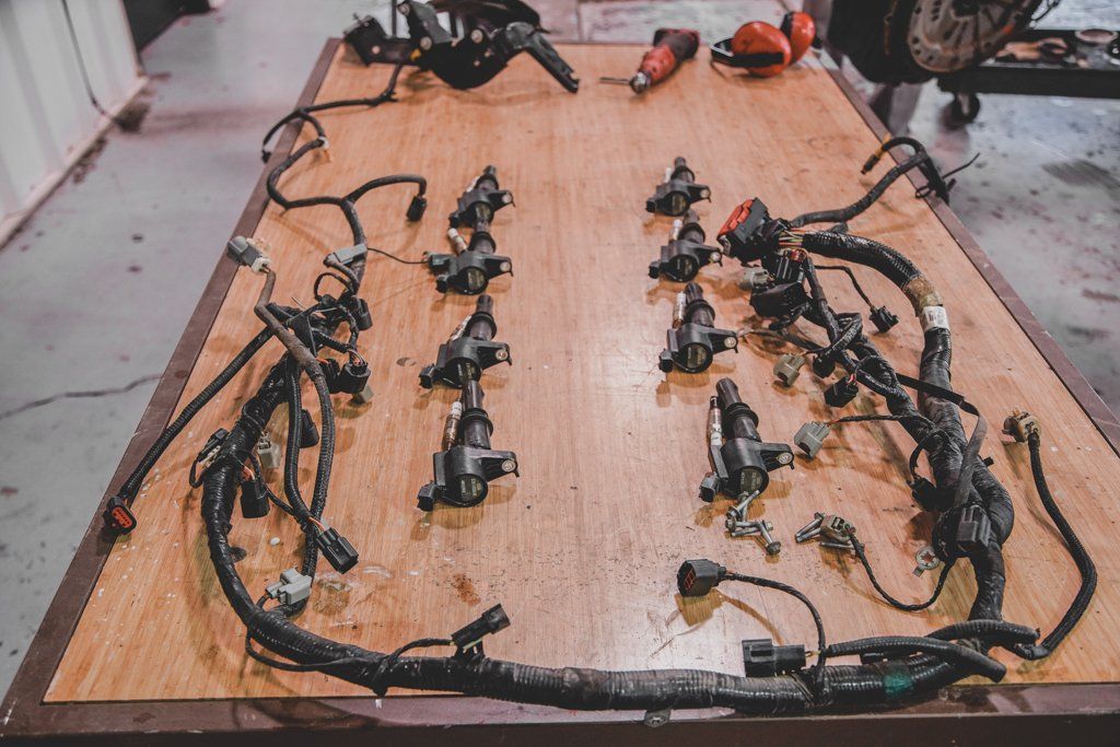 car parts organized on a workbench