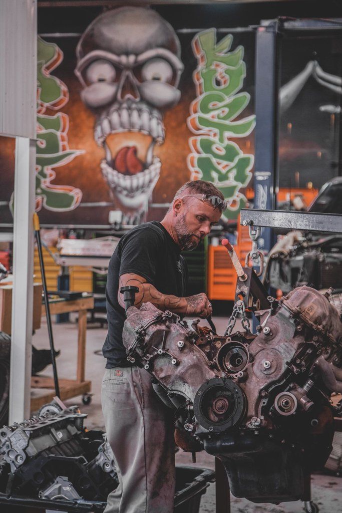 mechanic doing inspecting vehicle engine
