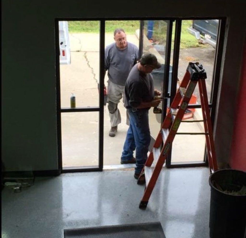 contractors discussing in doorway