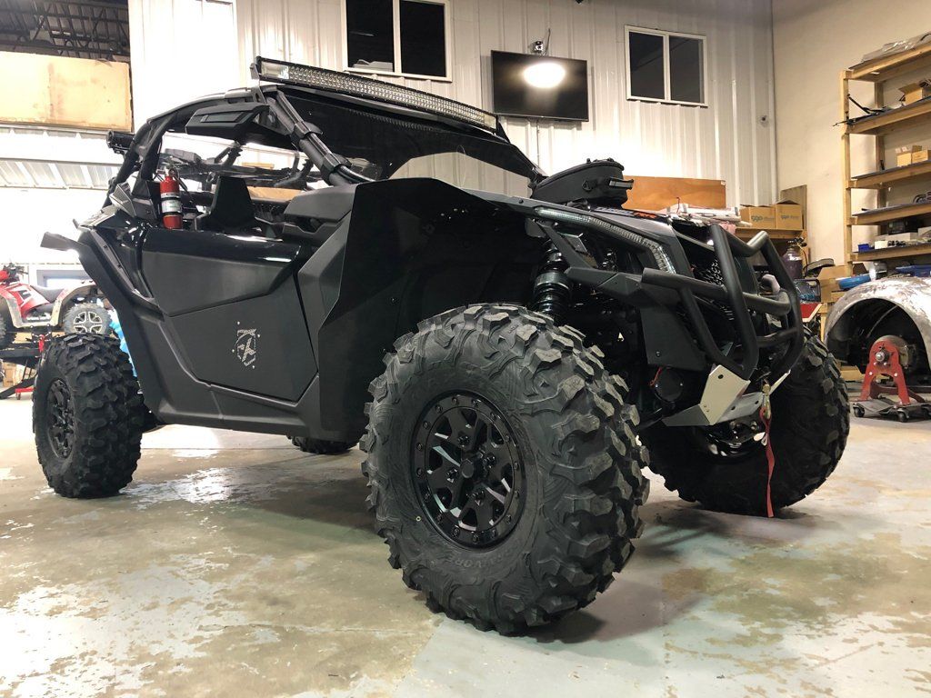 close up of custom black 2019 2-door maverick inside garage