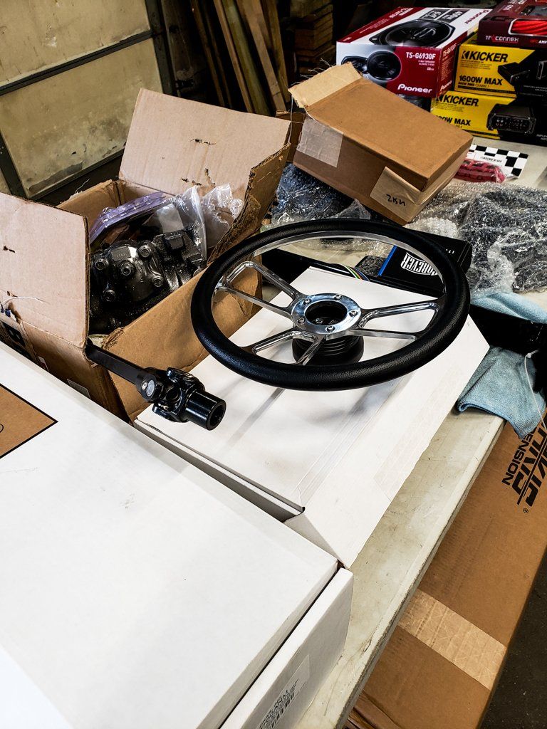 customized steering wheel in box on workbench