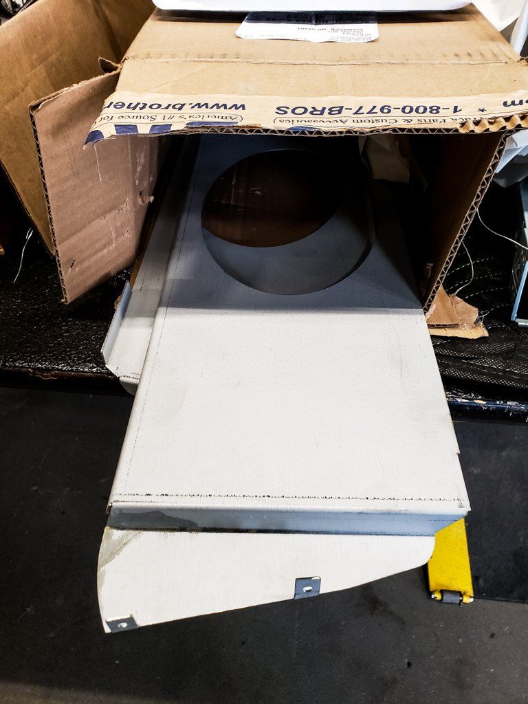 custom truck parts inside open box on side