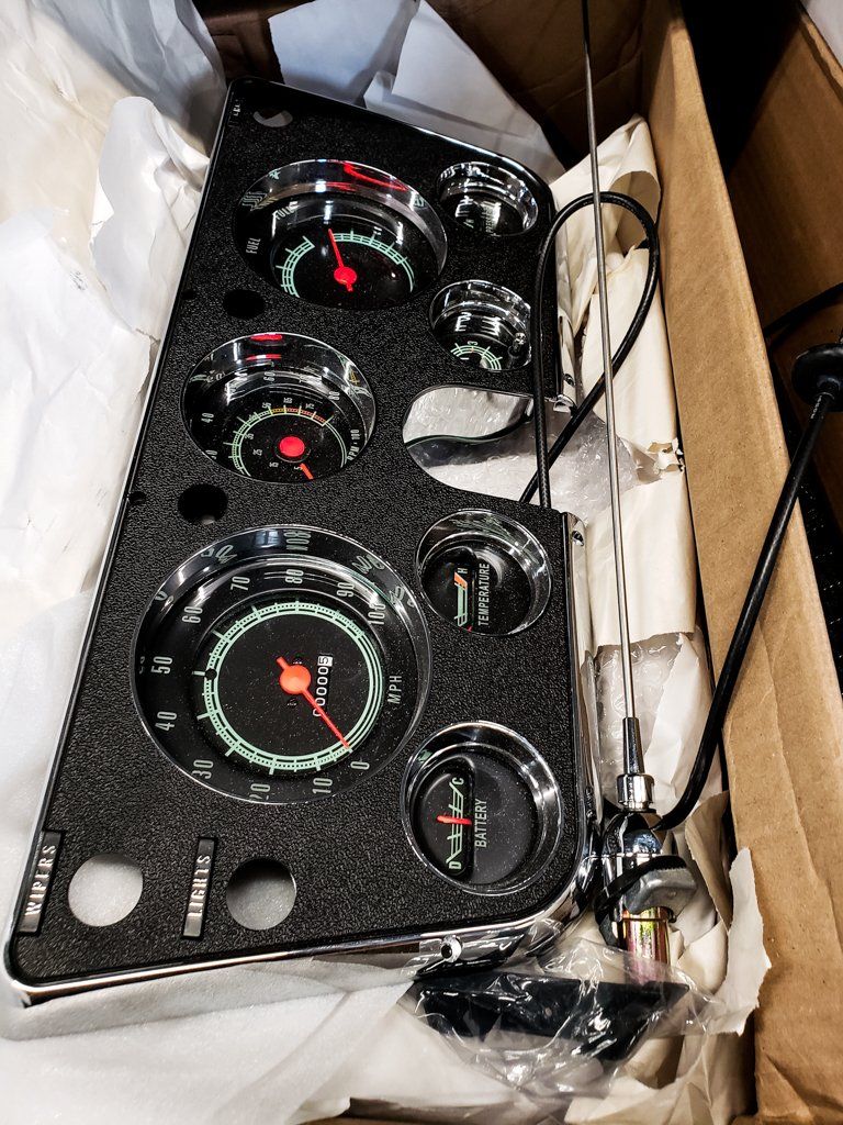 speedometer and front dashboard readings in paper in box