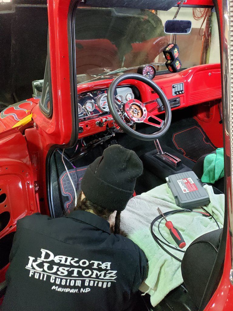 view of interior of 1962 customized red truck