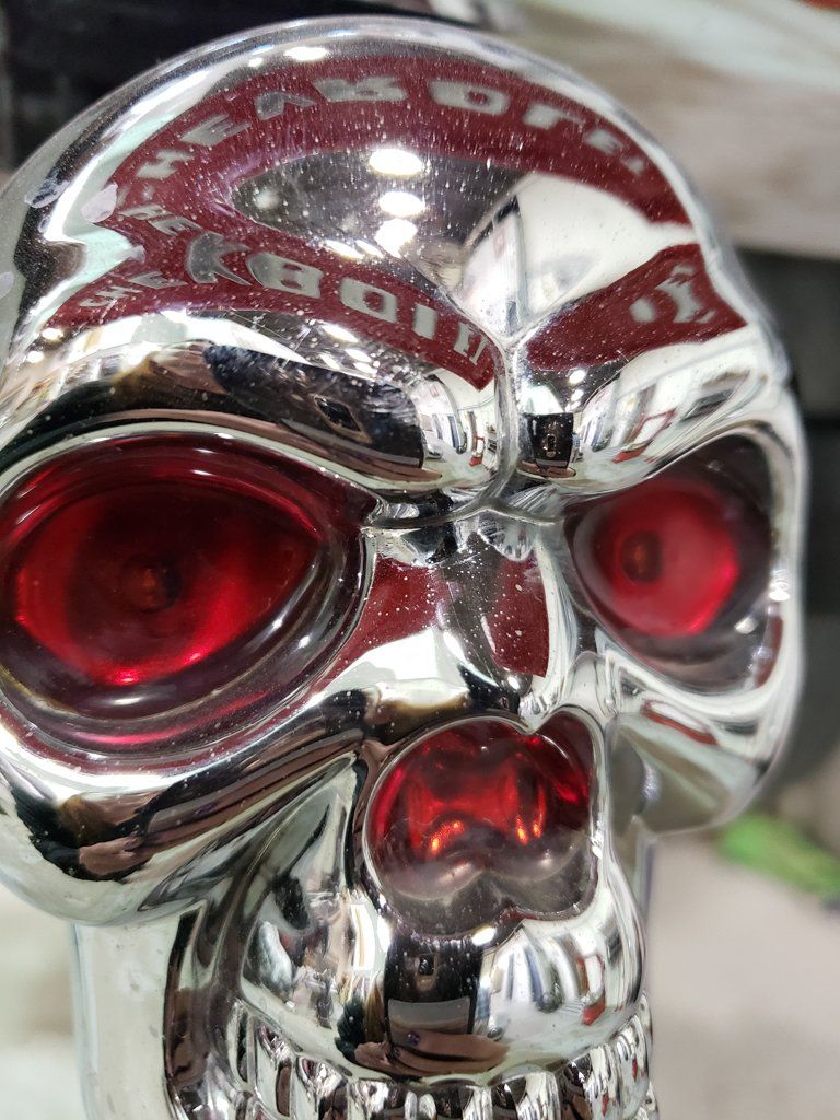 front view of customized chrome skull with red eyes and nose