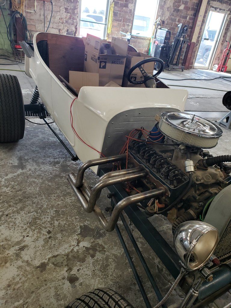 side view of customized white hot rod