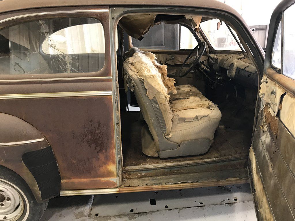 side view of deteriorating car seats and car ceiling
