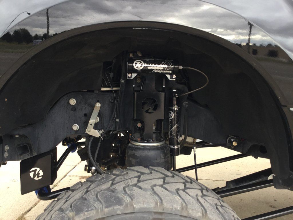 closeup of suspension hydraulic of custom truck