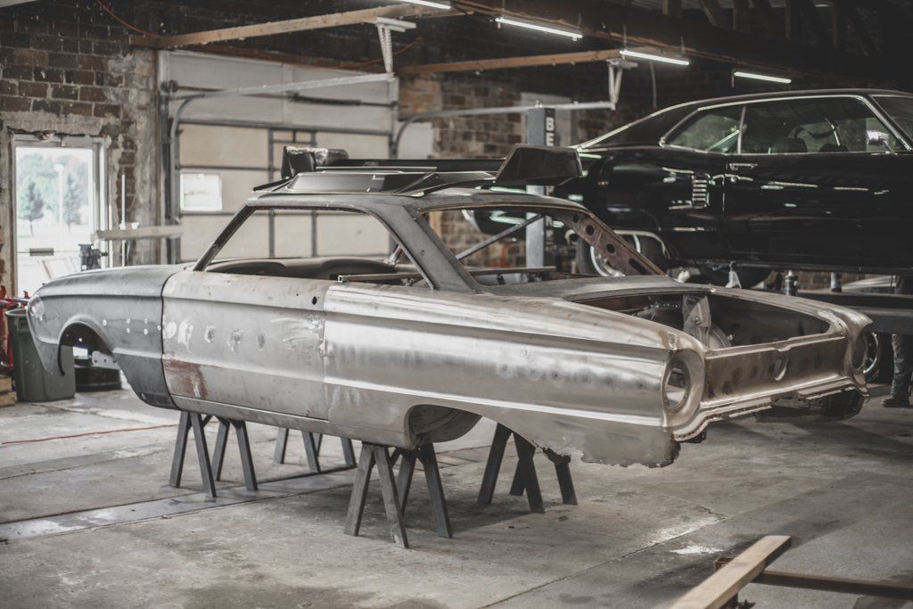 body of car suspended on raisers