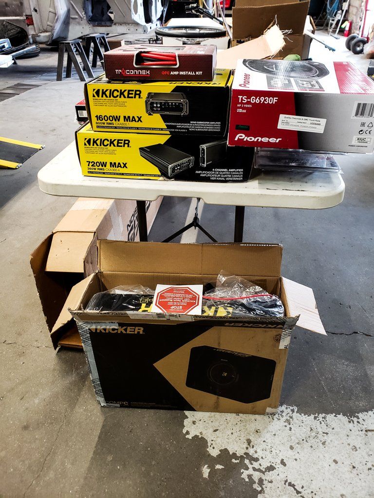 kicker brand boxes on table and garage floor