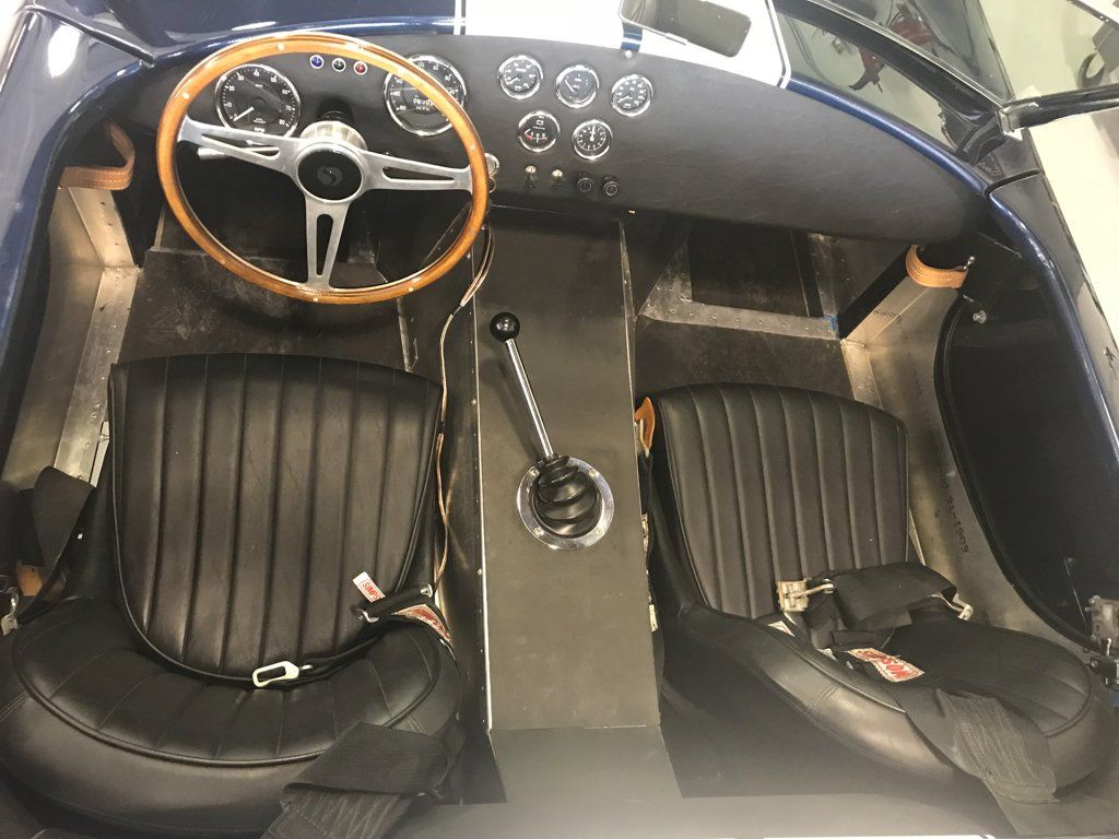 top view of front seats, steering wheel, and center console