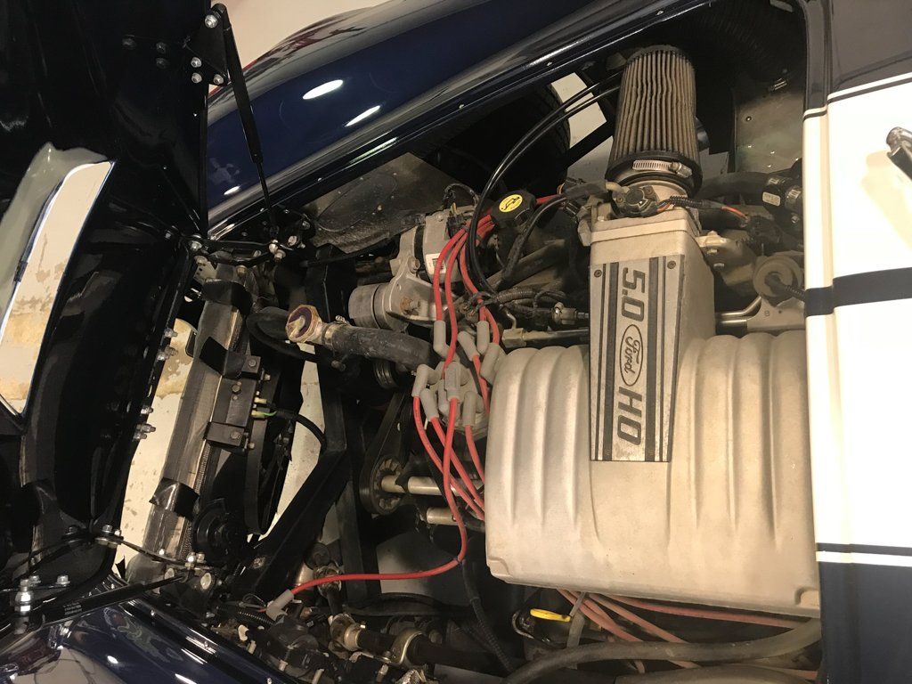 view of engine with car hood opened