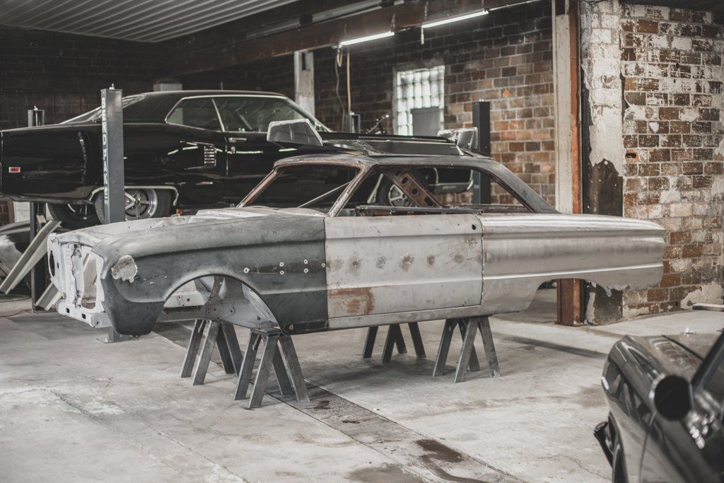 car frame suspended on raisers