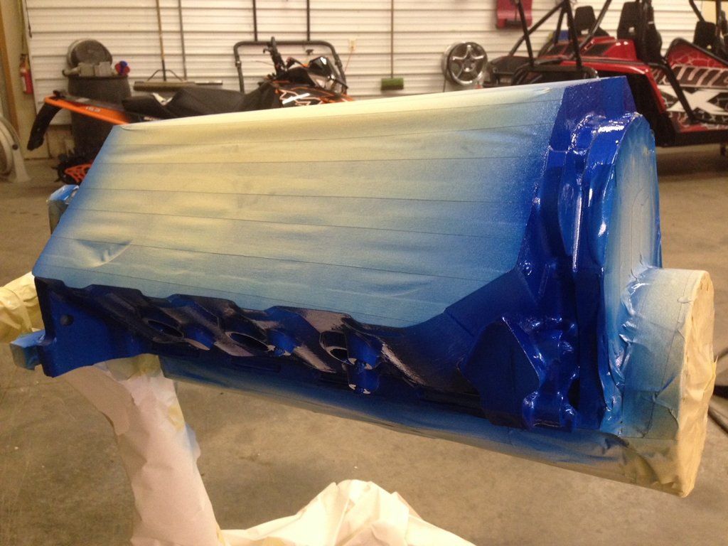 car part being painted with cover on top