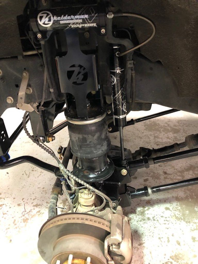 close up of truck axel with wheel removed