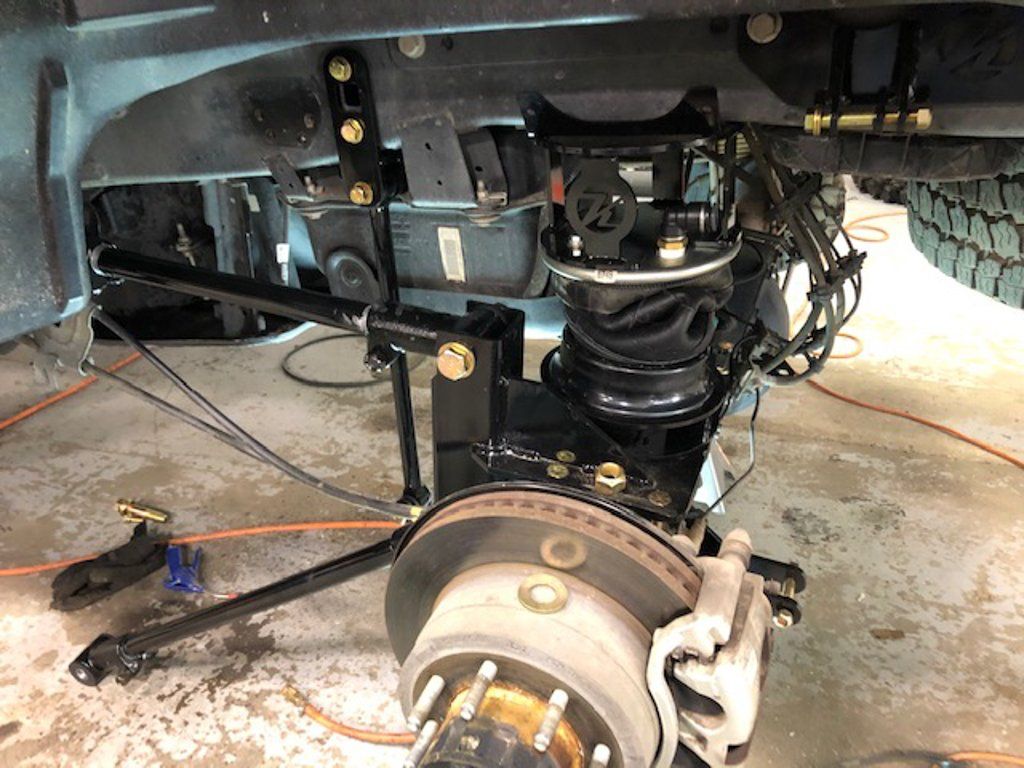 close up of truck axel with wheel removed