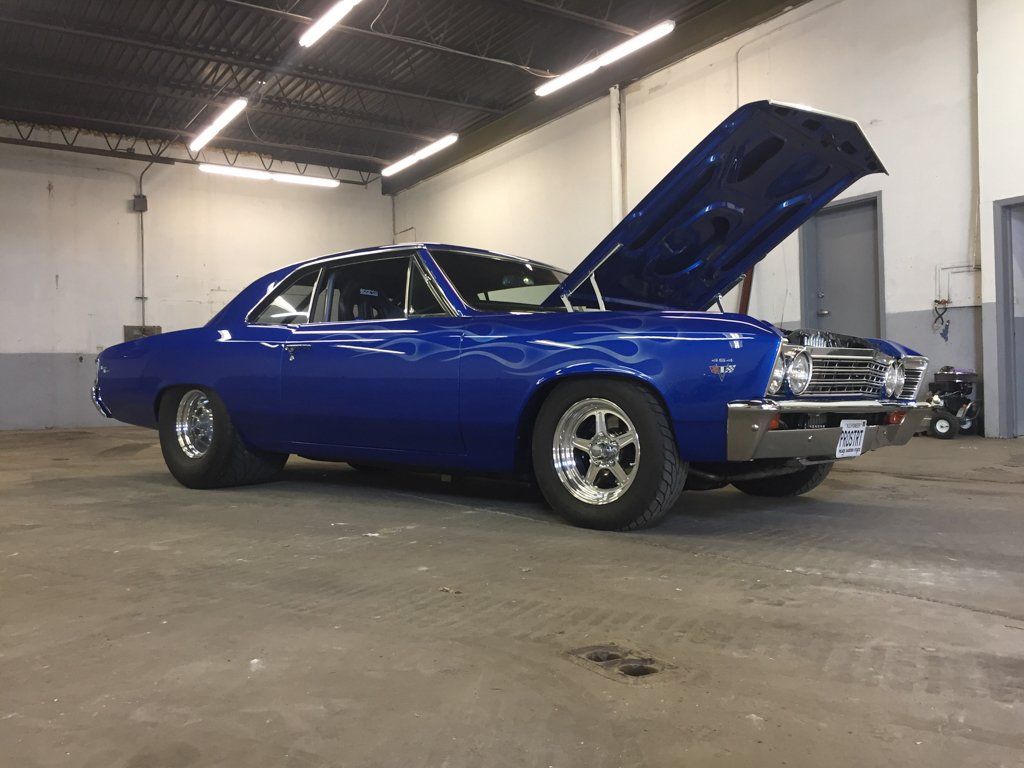 side view of car with hood open