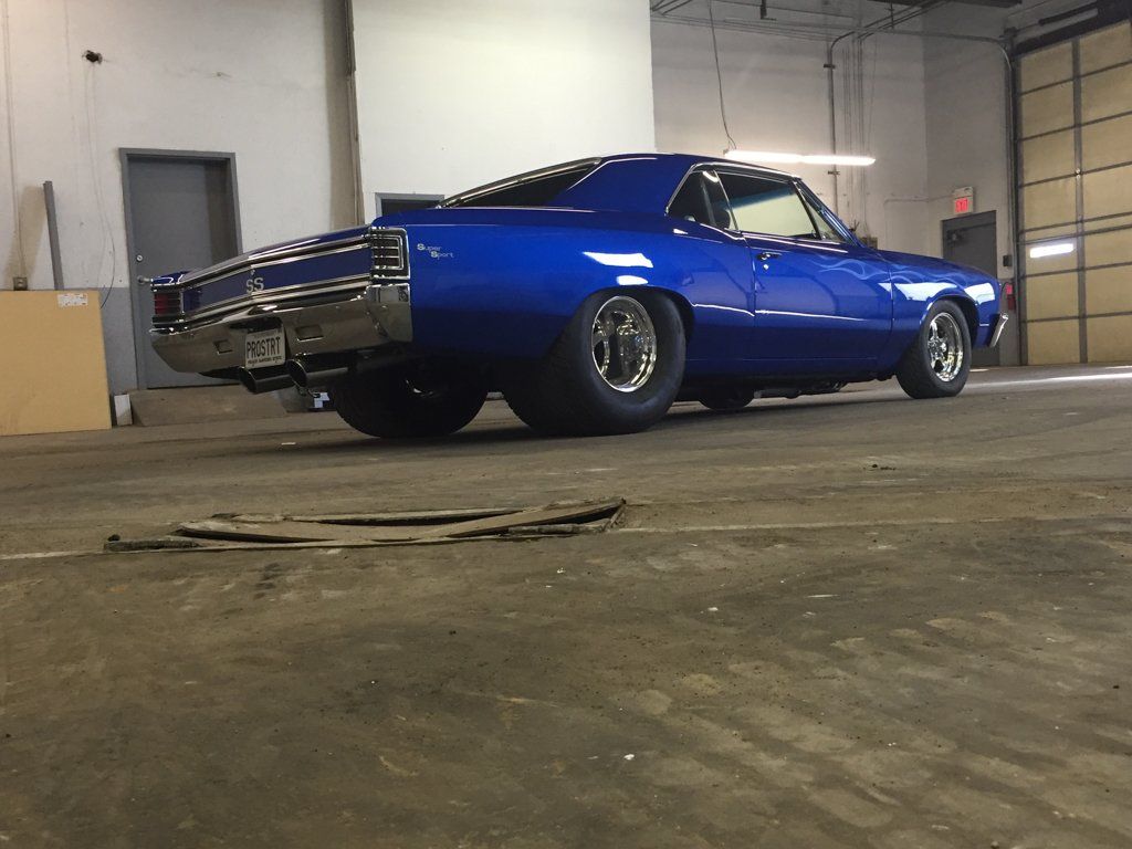 low rear view of car in empty service garage