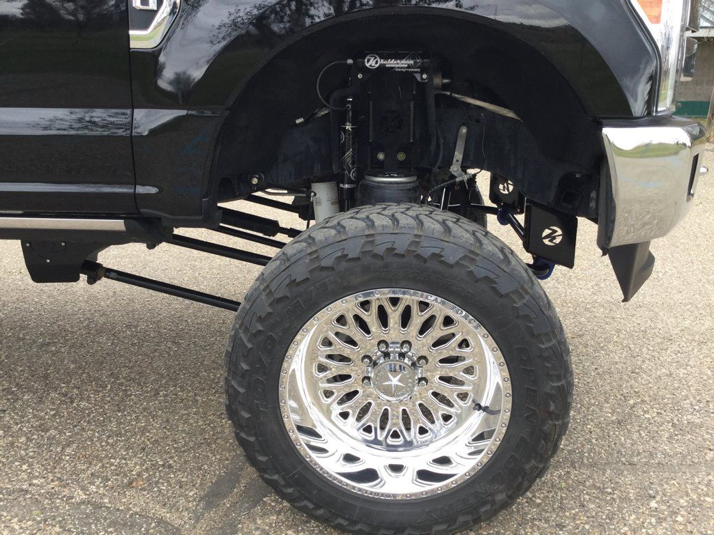 close up of custom truck chrome rim wheel
